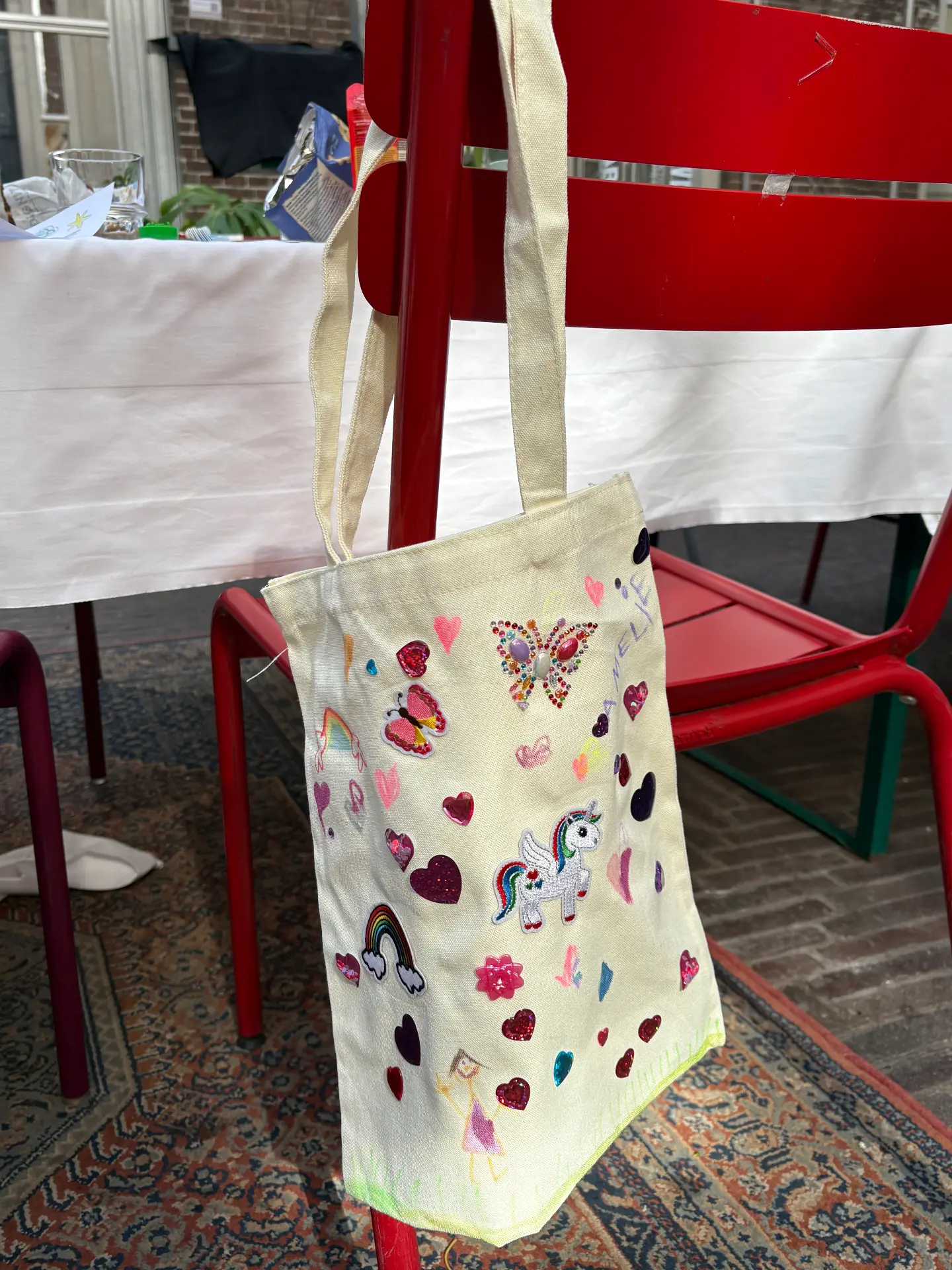 Personalised tote bags hanging at a Mini Munchkins workshop