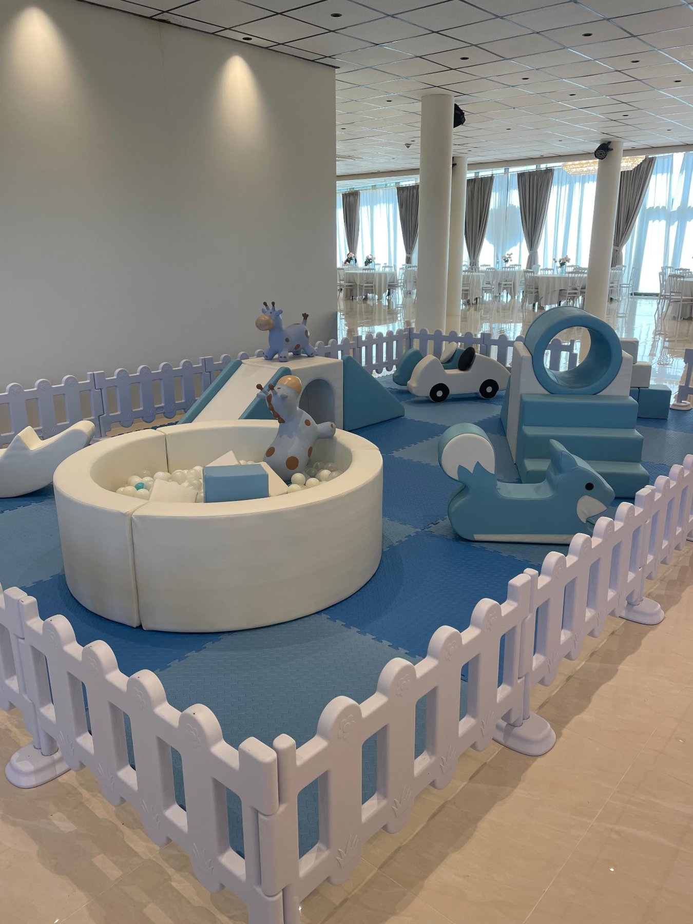 Soft play ball pit and ride-on toys at a Mini Munchkins venue event