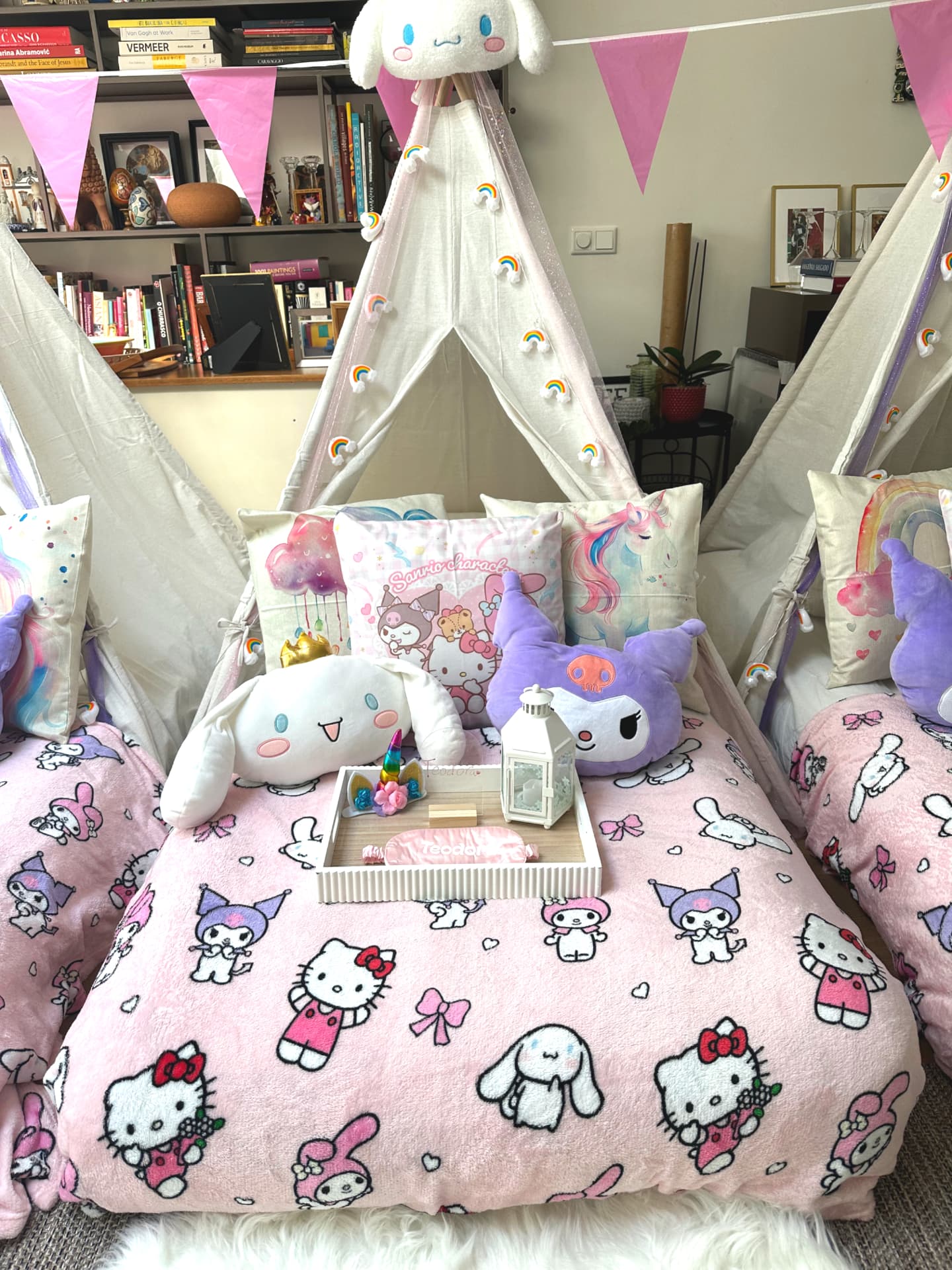 Styled teepee tent with fairy lights and plush cushions at a sleepover