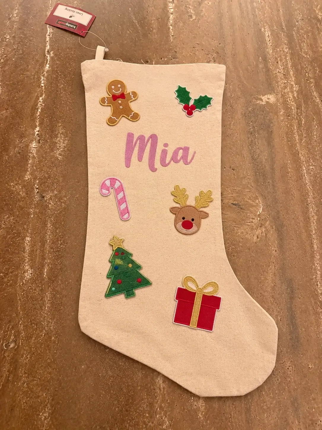 Gepersonaliseerde canvas kerstsok met de naam Mia en kerstpatches