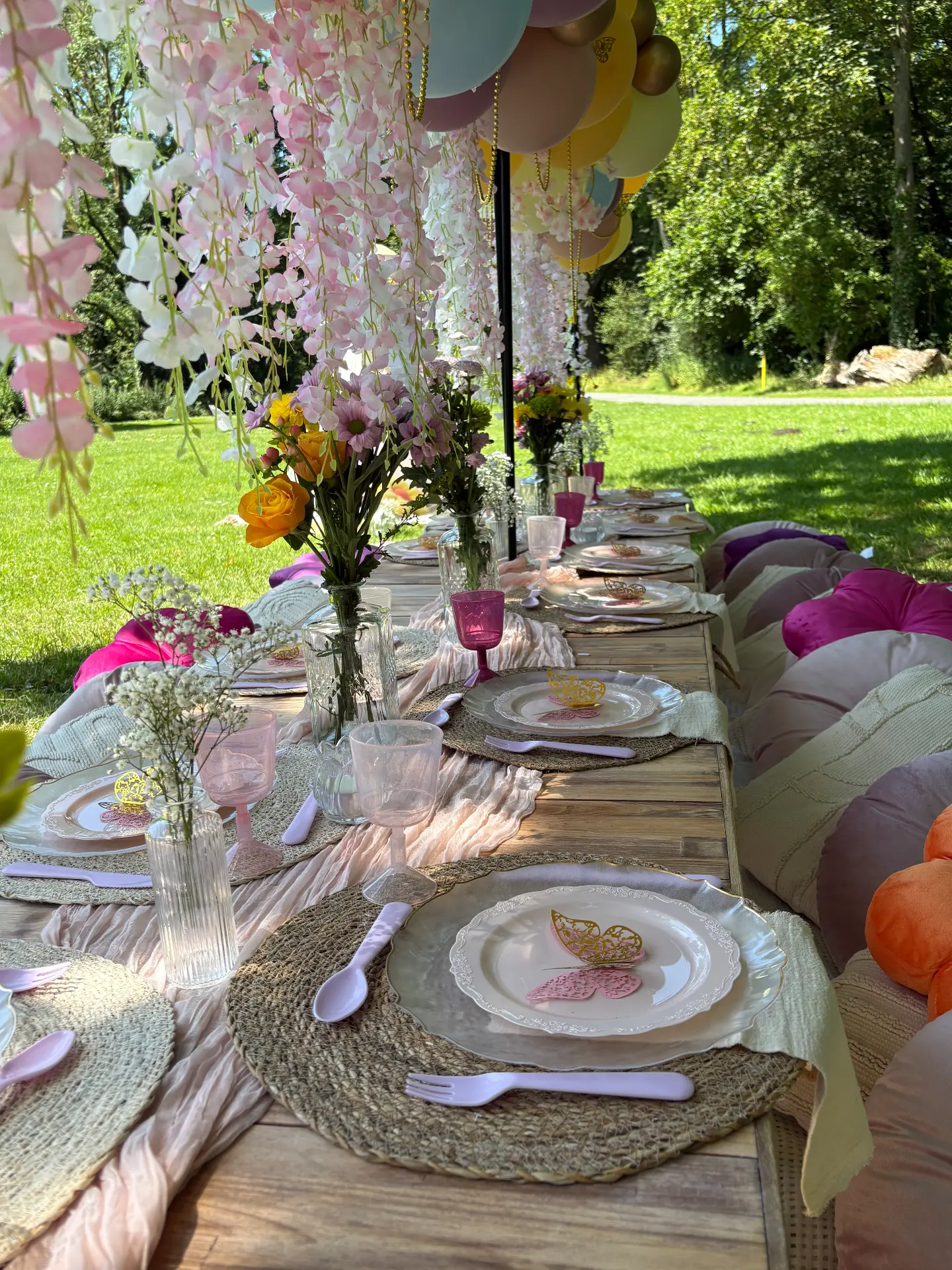 Flowers, tableware and hanging details at a styled Mini Munchkins picnic
