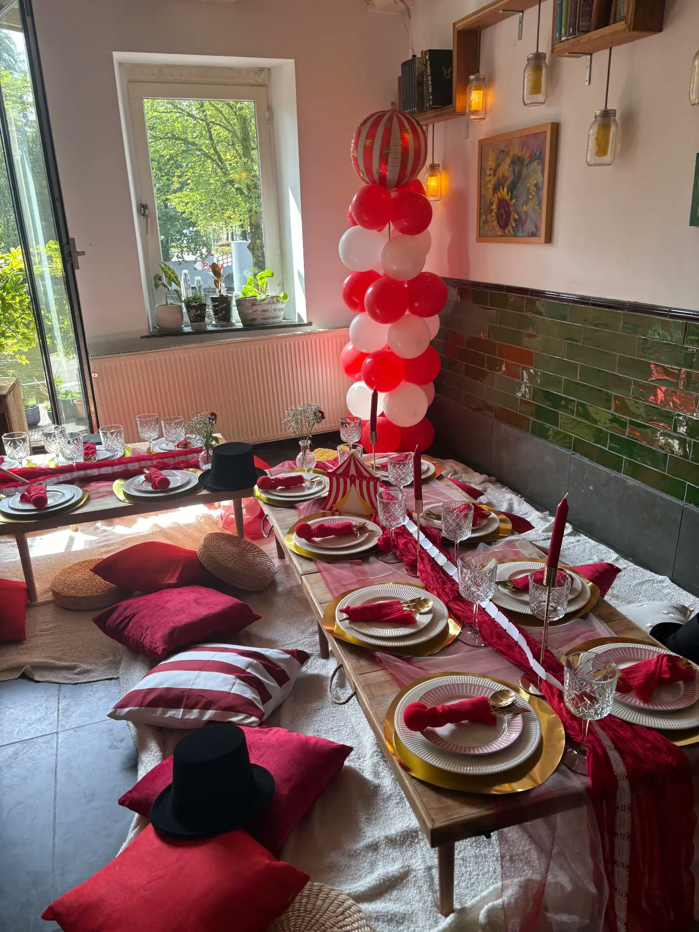 Rich red indoor celebration table with balloon styling