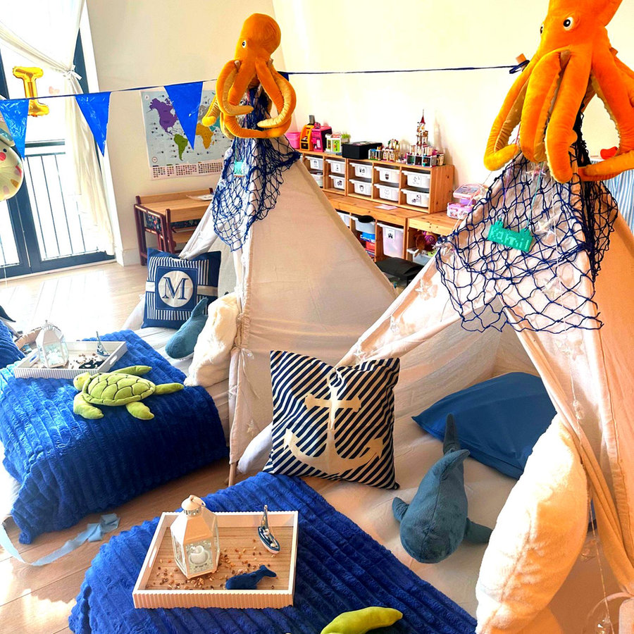 Neutral teepee sleepover setup with cosy bedding