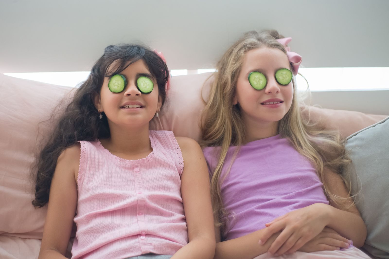 Two girls enjoying a playful spa activity together